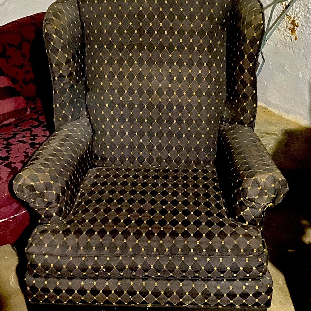 Wing back chair reupholstered in black pattern
